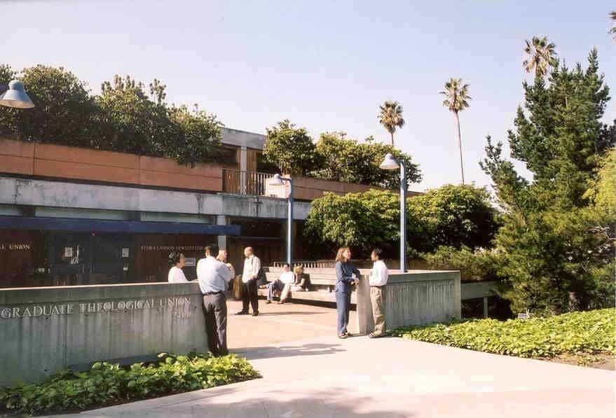 Graduate Theological Union library with people talking in front