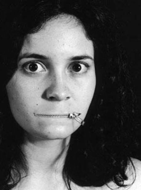 Woman with her lips replaced by a zipper that keeps her mouth closed.