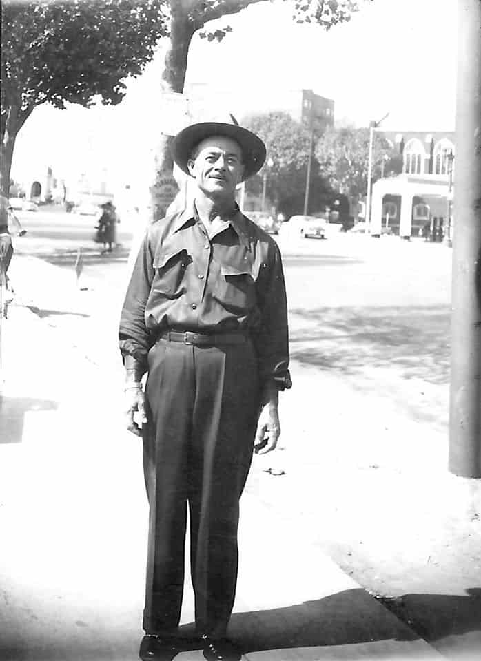 Juan Reynoso standing on a sidewalk.