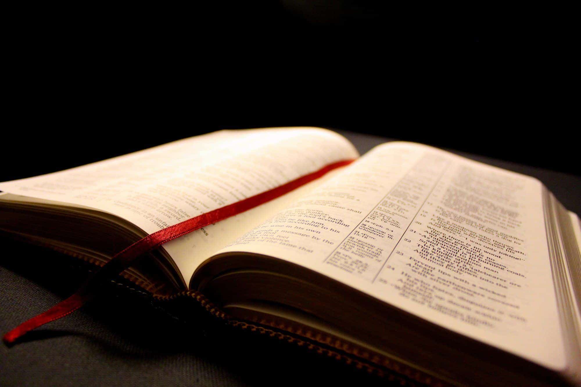 open bible with a red page marker