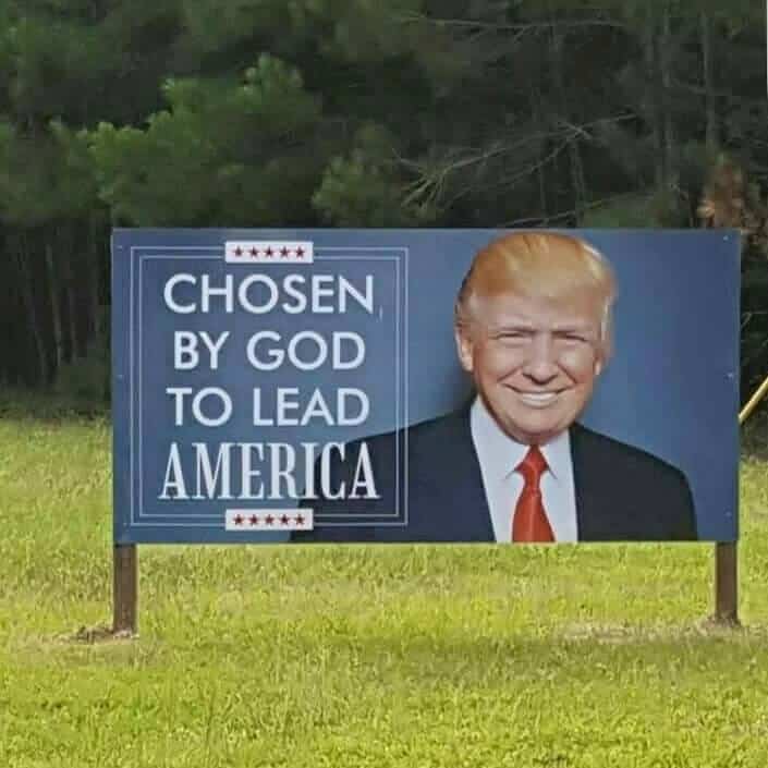 A billboard with a picture of Donald Trump that says "Chosen by God to lead America."