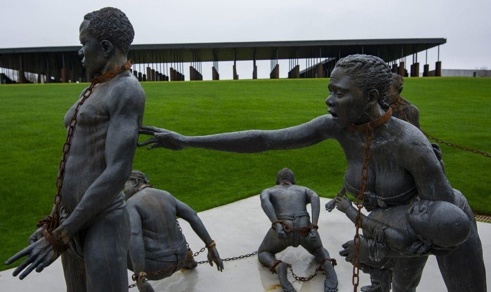 Legacy Museum bronze sculptures depicting chained men, women and children.