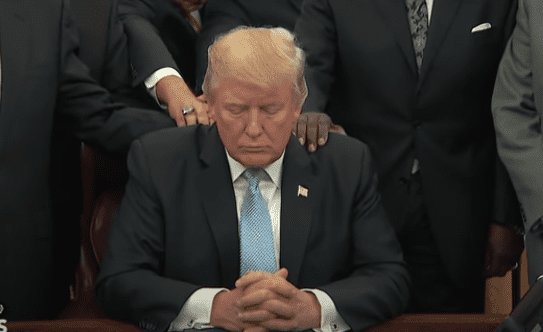 Trump praying