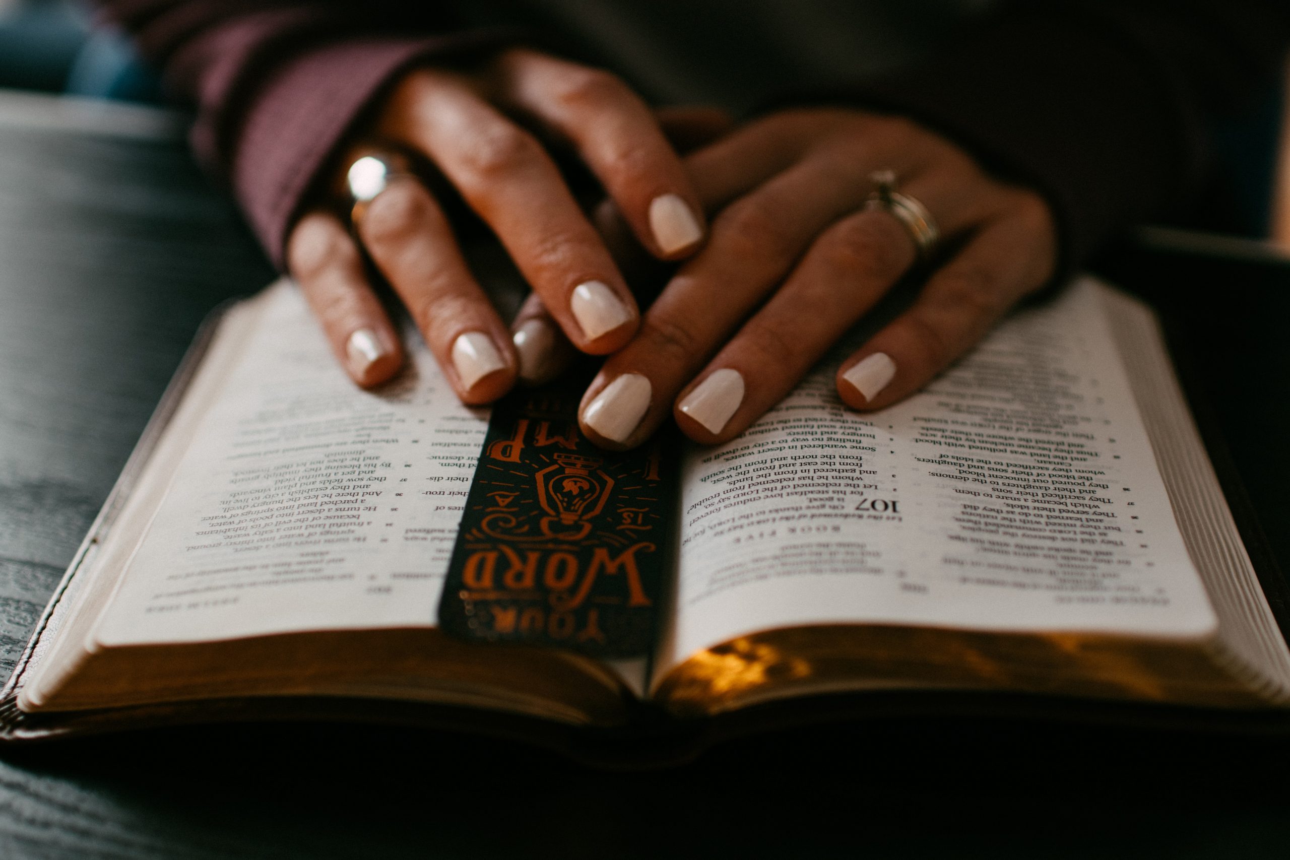 Woman's hands on a Bible