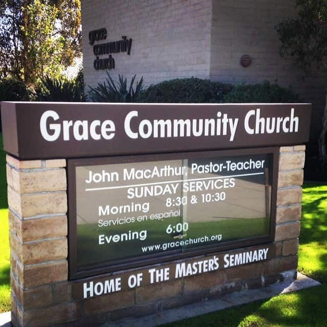 Photo shows the brick sided sign of Grace Community Church on it's lawn.