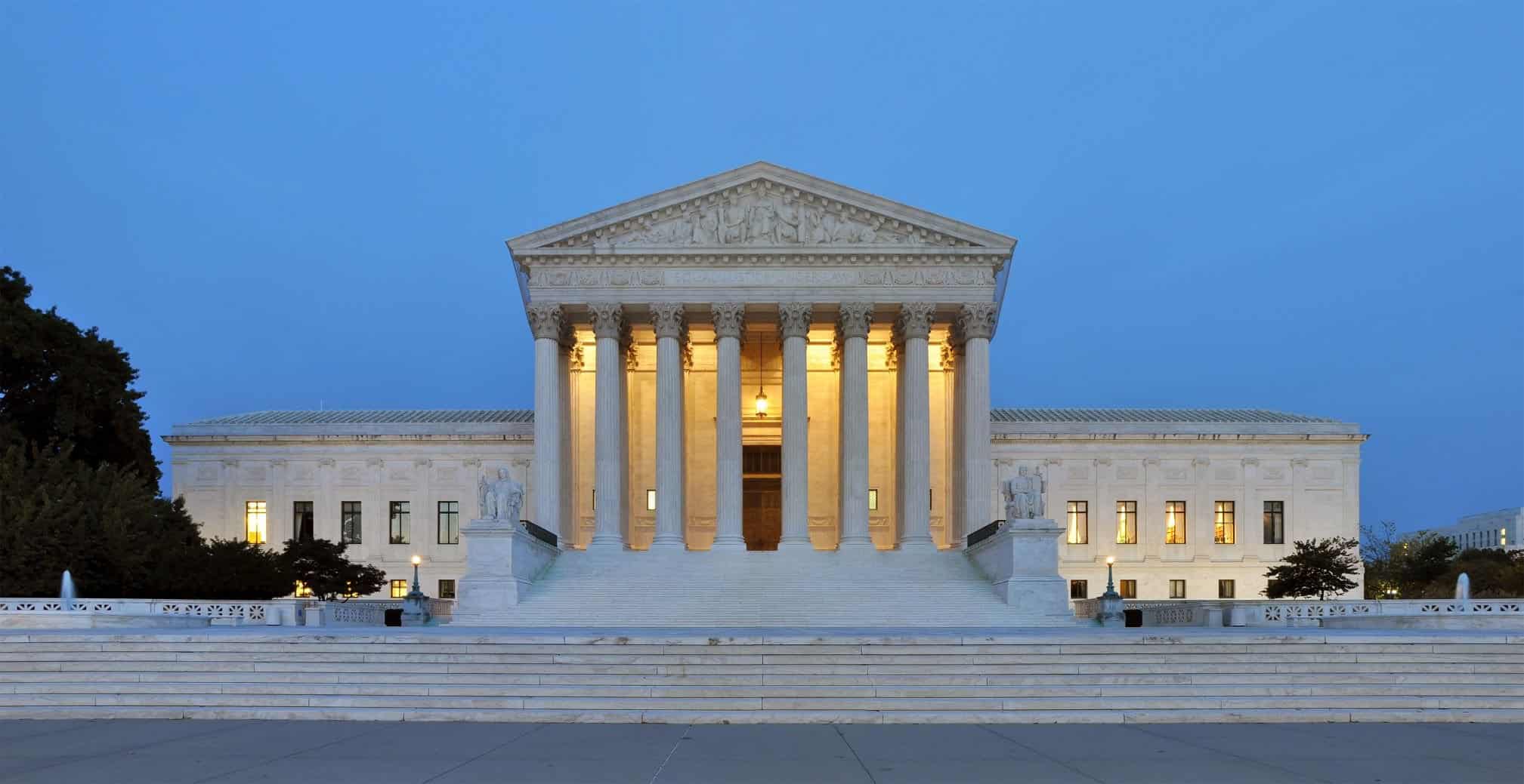 The front steps of the US Supreme Court are shown at dusk