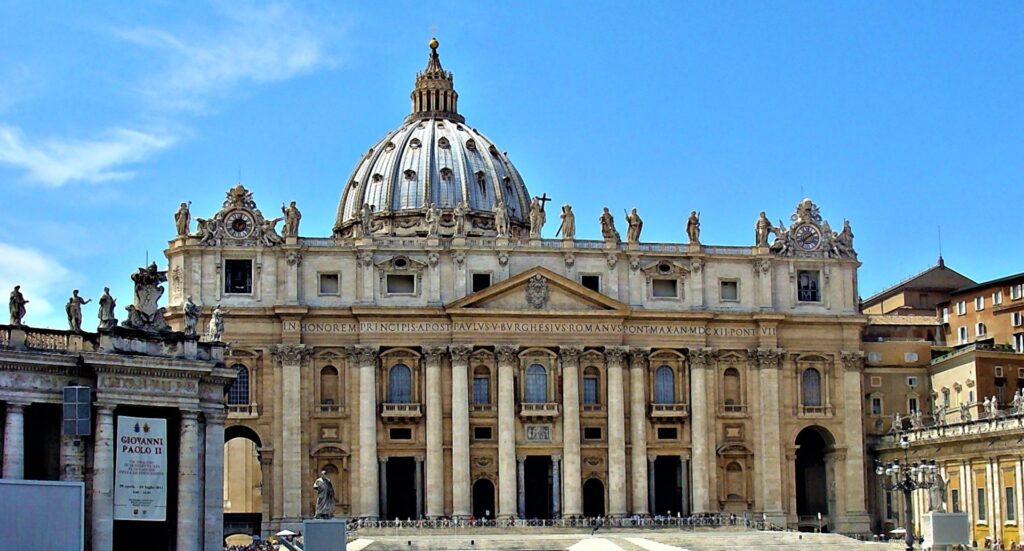 a street view photo of St. Peter's Basilica is shown against a blue sky