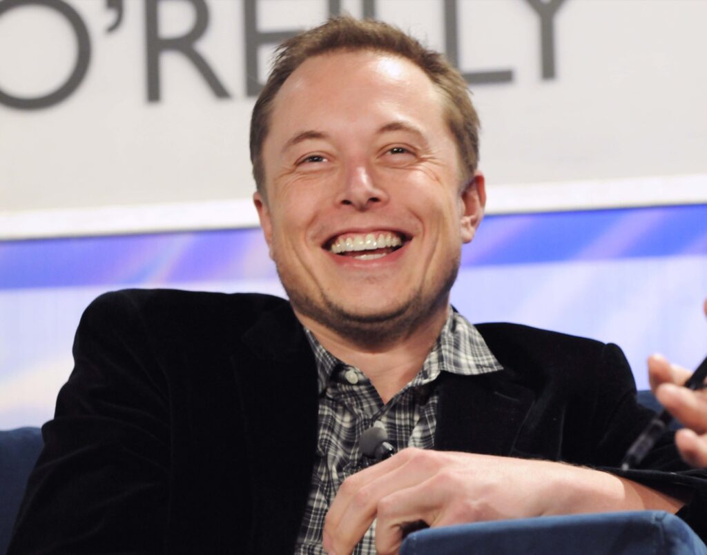 a front view of Elon Musk with a full smile
