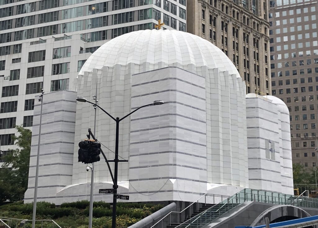 A street view is shown of the domed and predominantly white stone St. Nicholas Chapel in Manhattan.