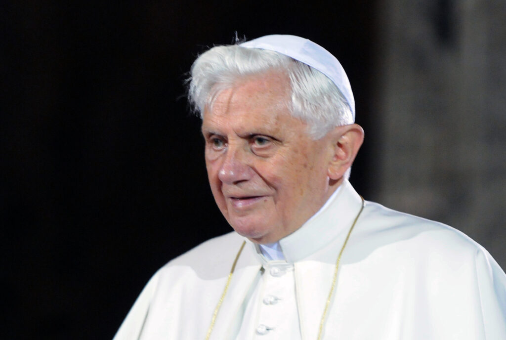 Photo shows Pope Benedict XVI in white and from the shoulders up.