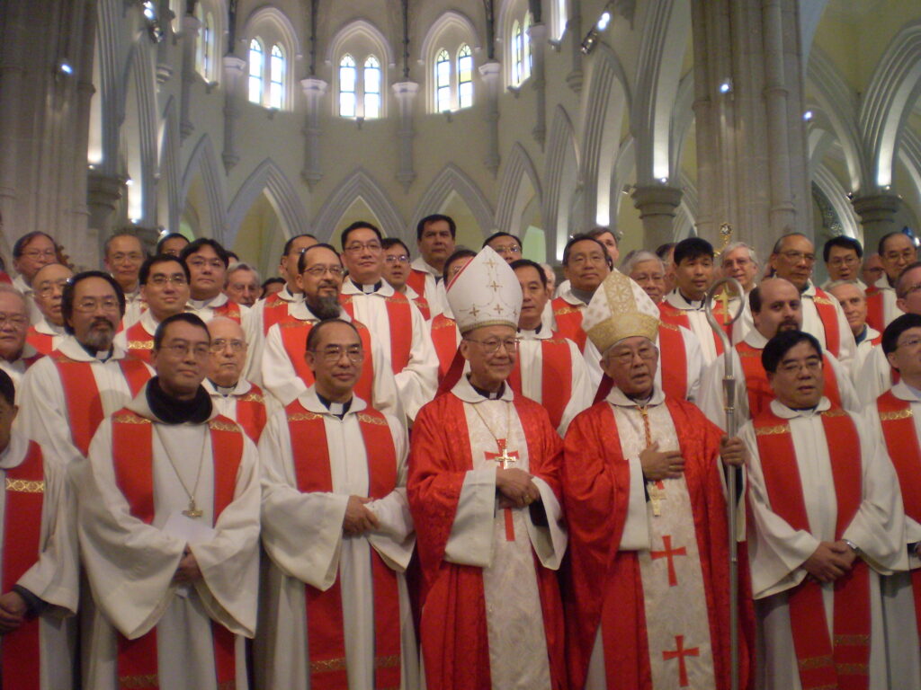 A group of Roman Catholic's from Hong Kong are shown with a couple high ranking men.