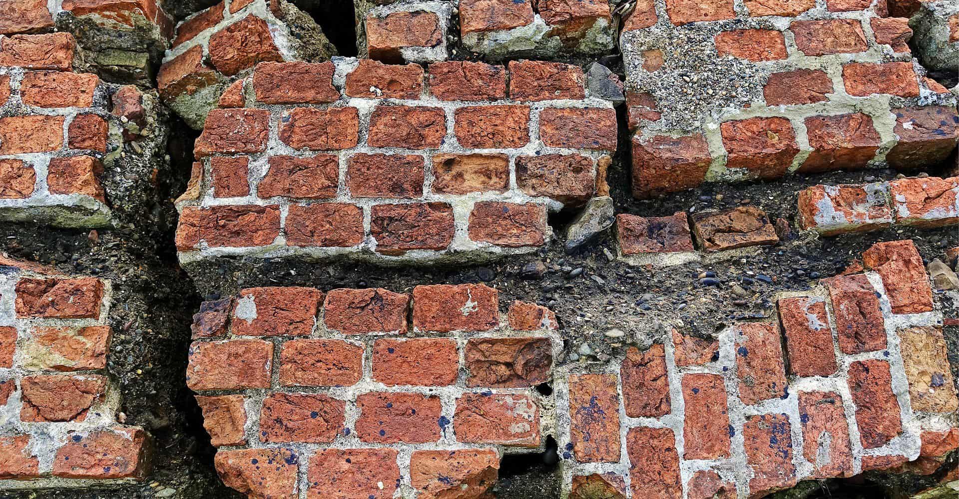 The remains of a brick structure are shown via large chunks of mortared bricks.