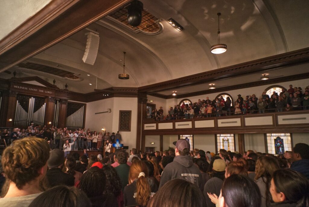 Asbury's chapel is seen from the back and crowded with people.