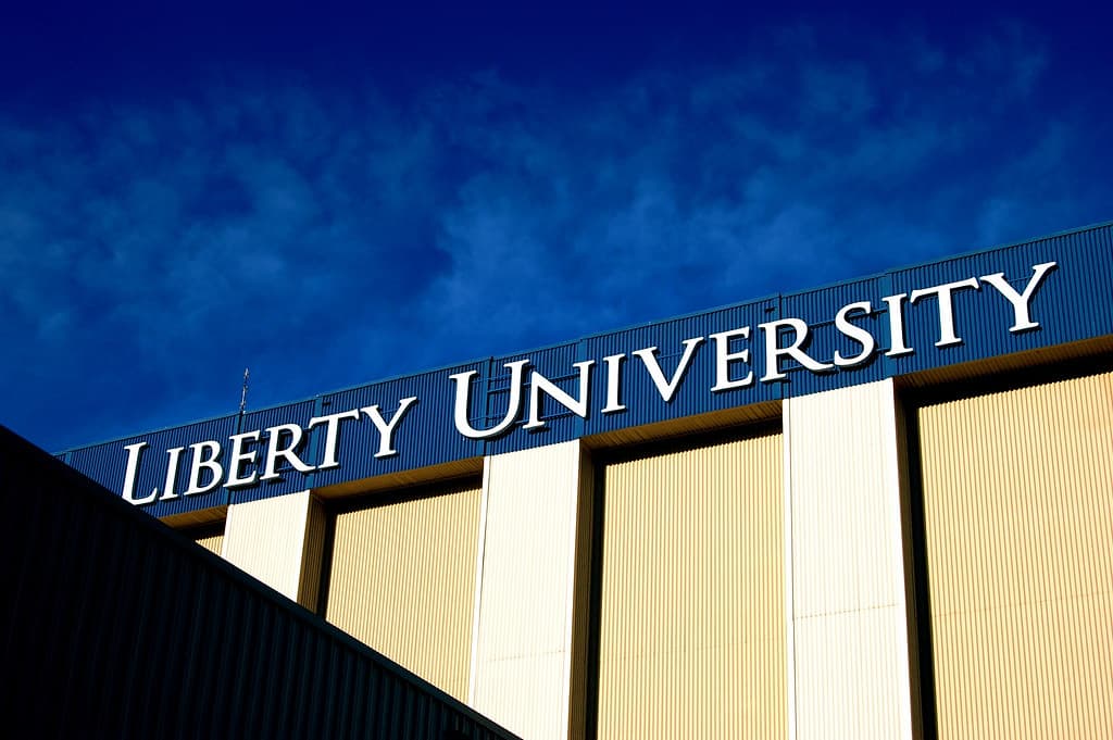 A sign for Liberty University is shown on a building.