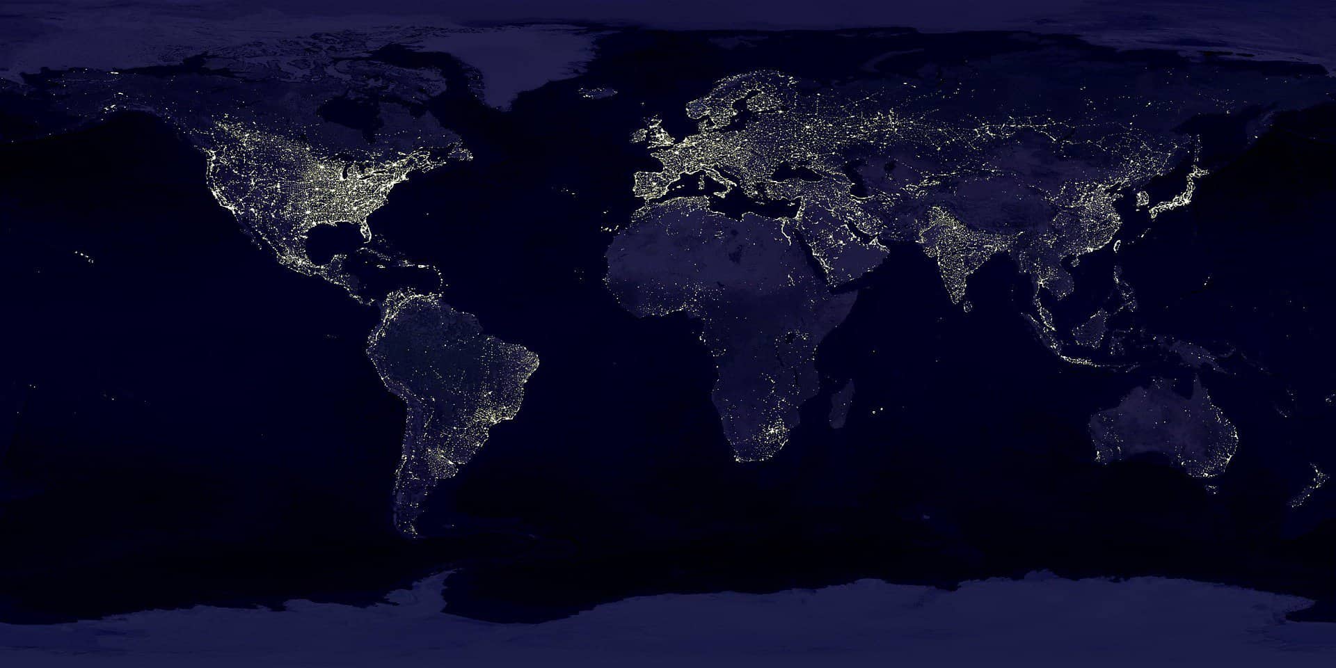 The earth and it's lights are seen from space at night providing the outlines of continents.