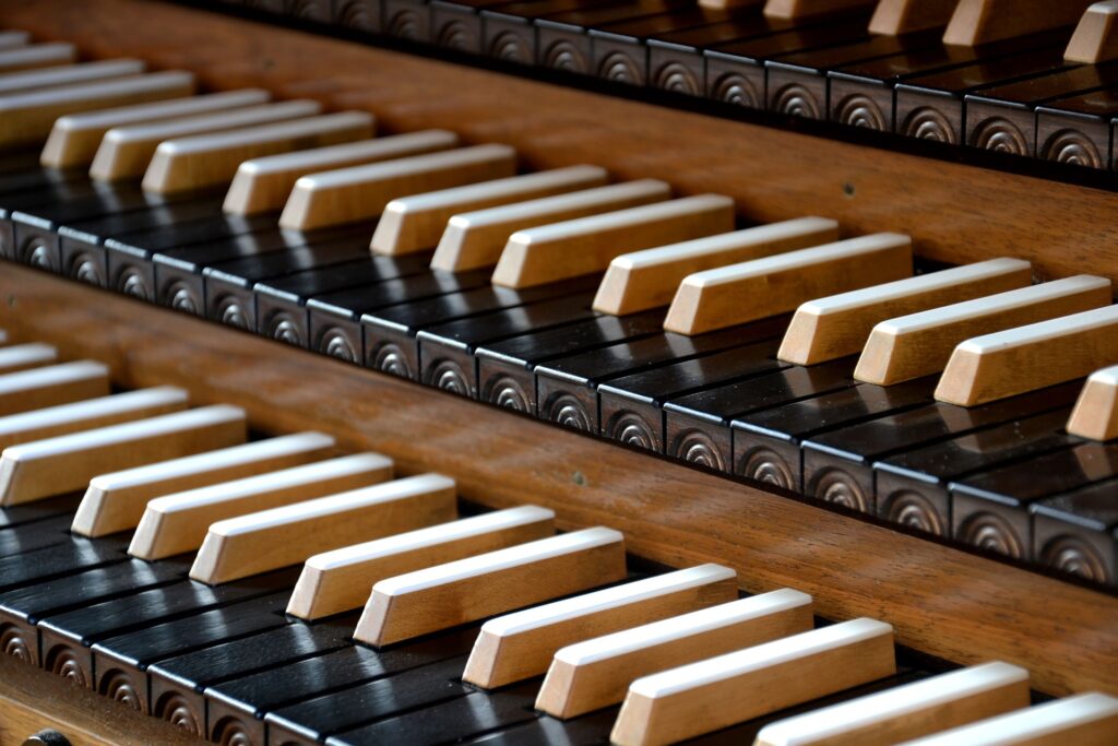 An organ's keyboards are shown close up.