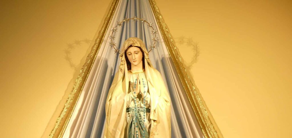 A statue of the Virgin Mary is shown.