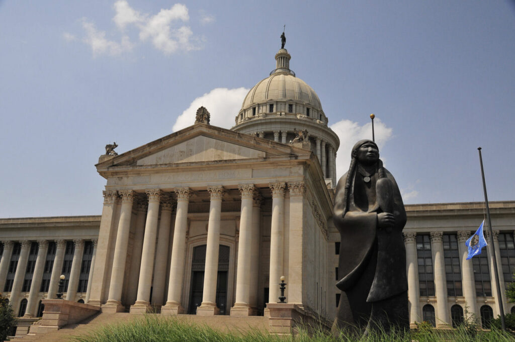 The Oklahoma state capitol is shown from street level.