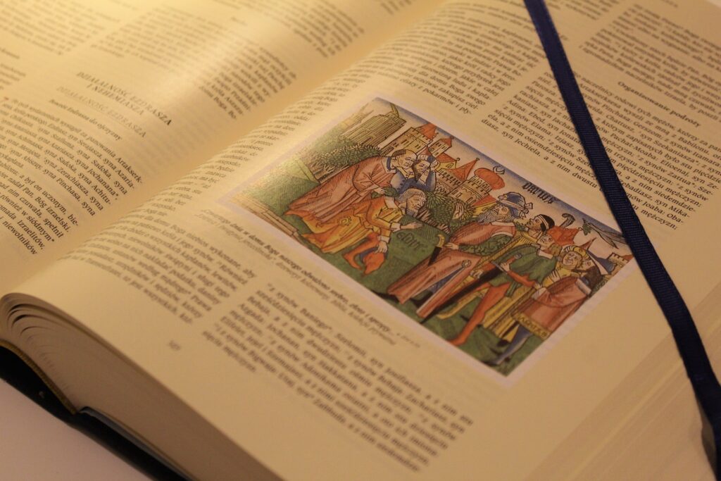 A page of an illustrated Bible in a non-English language is shown.