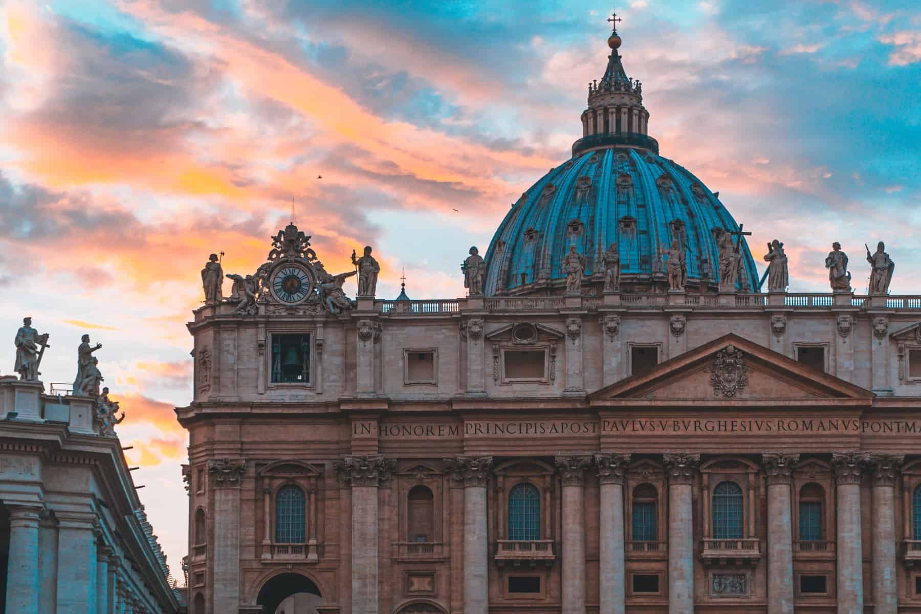Famous St. Peter's Basilica in Vatican City and the sky with beautiful colors behind