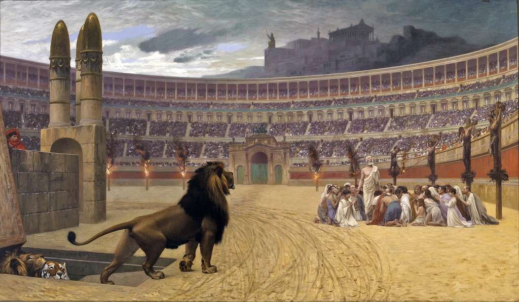 A lion is seen in a colosseum facing a group of huddled people.