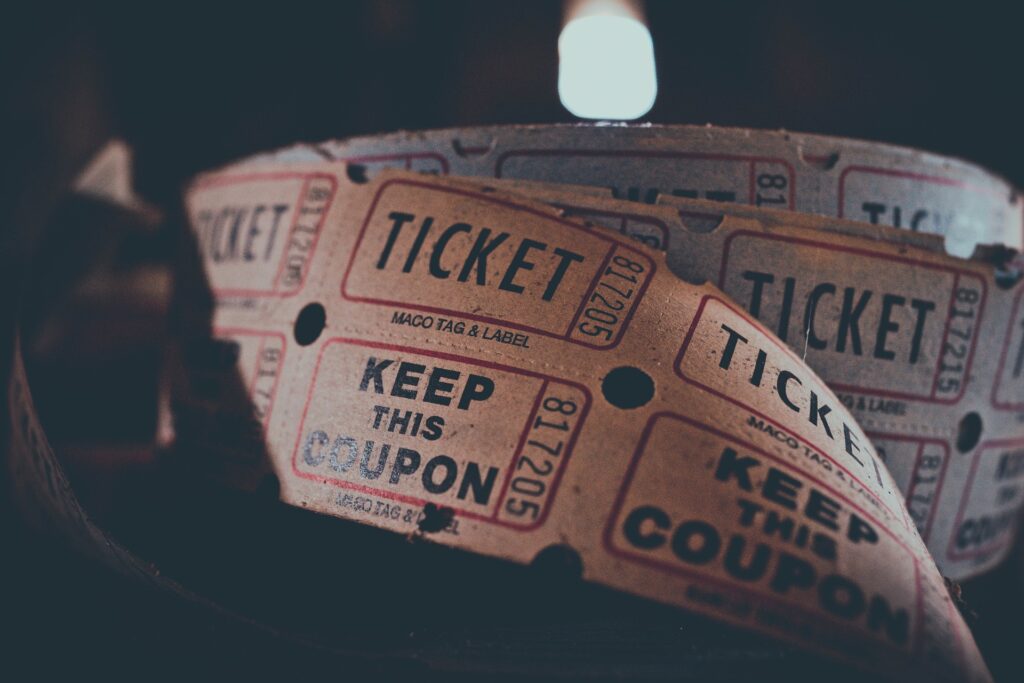 A roll of movie tickets is shown close up.