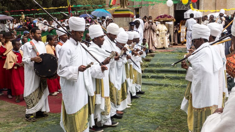 Orthodox priests dancing in front of Saint Mary church for 2015 Timkat in Addis Ababa, Ethiopia