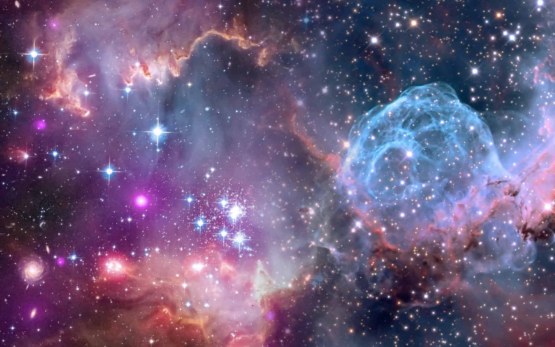 Image shows a colorful cloud of gases such as often depict outer space.