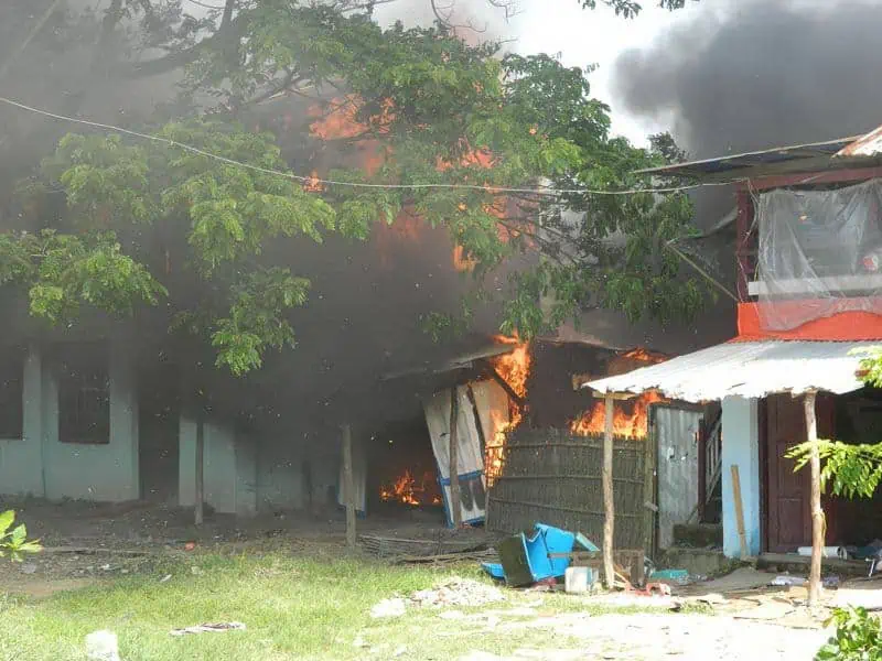 Photo shows a building in the Rakhine village being burned.