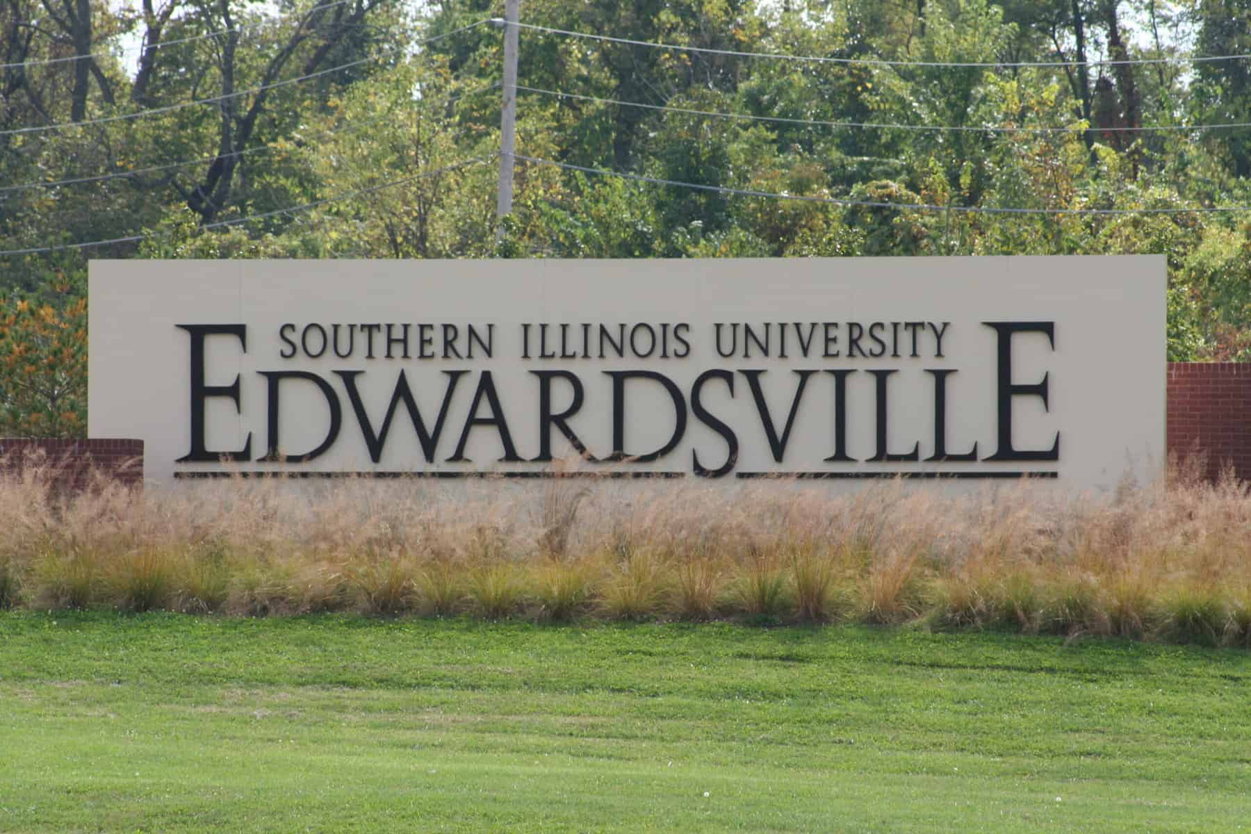 The sign for Southern Illinois University at Edwardsville is shown surrounded by grass.
