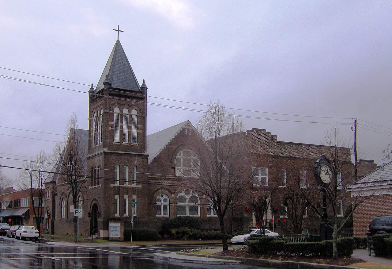 Broad Street United Methodist Church in Cleveland, TN is shown on a cloudy morning.