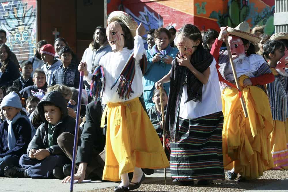 Hispanic Americans hold a parade and fiesta at St. Procopius Elementary School in Chicago to celebrate Dia de los Muertos.