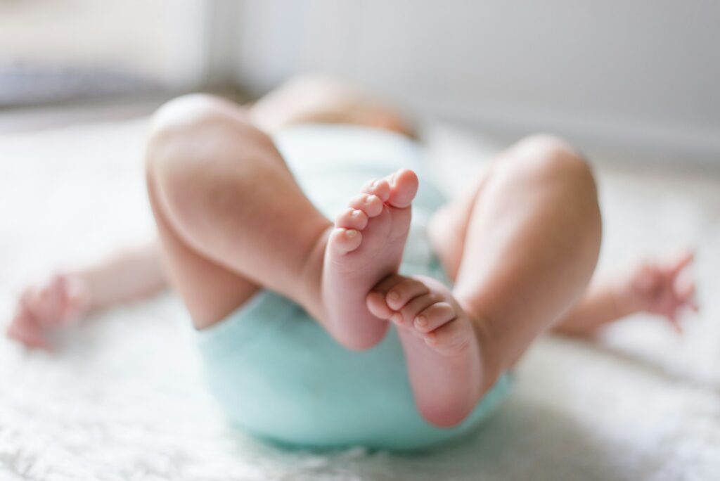 How Detroitโs Metro Church supports single moms in a new pro-life approach A baby's feet are in focus with the rest of the body out of focus.