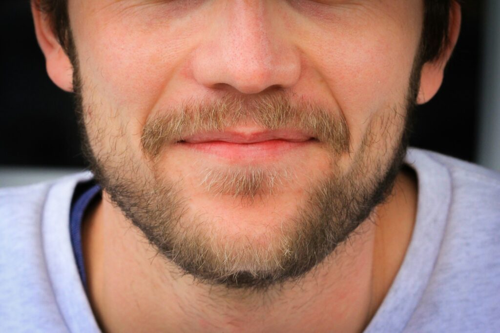 Lower half of a white man's face.