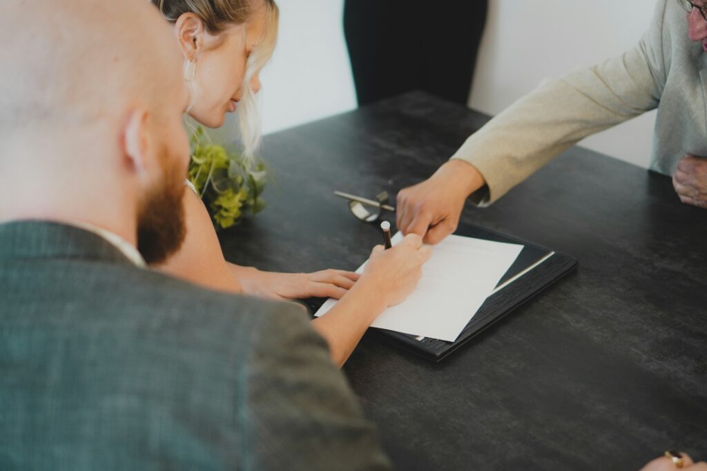 A woman signing a contract.