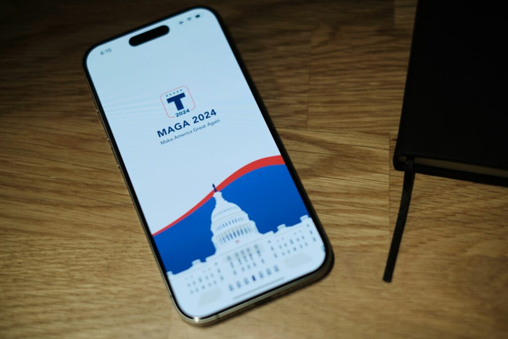 Evangelicals leaving MAGA: Faith leaders confront Trumpism’s grip A phone with a MAGA site showing sitting next to a bible. Evangelicals leaving MAGA.