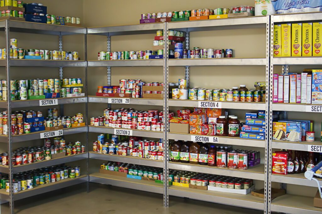 Federal SNAP Halt: Urgent resources for families and congregations Food pantry shelves with a selection of items.
