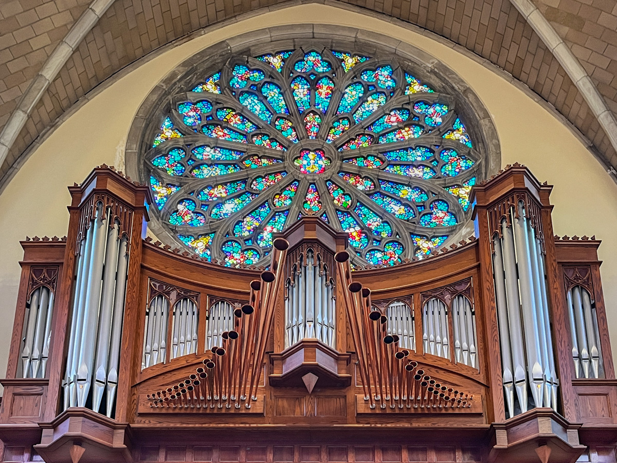 All Saints Sewanee rose window and organ pipes.