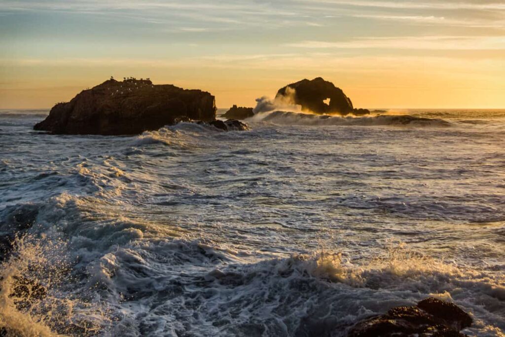 From Grief to Hope: Remembering the Character of God (Lamentations 3:31-33) Waves at sunset crashing into the rocks at Sutro Baths near San Francisco.