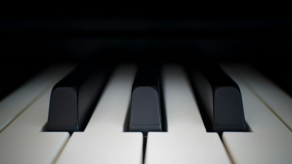 A very close up photo of piano keys.