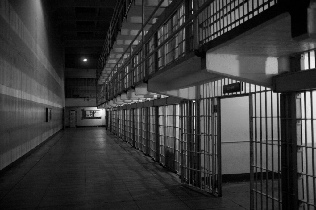 Black and white image of the inside of a prison.