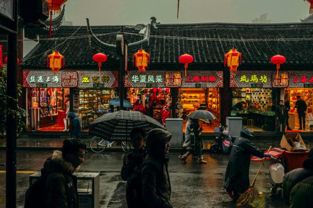 People walking in the rain in Shanghai.