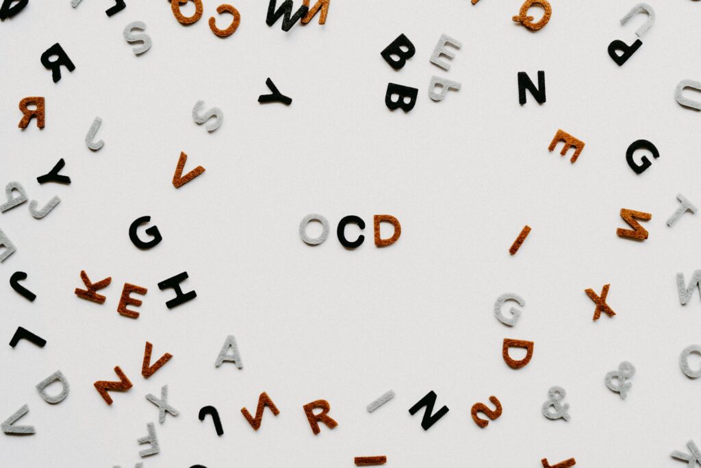 Random multicolored letters with OCD in the middle.