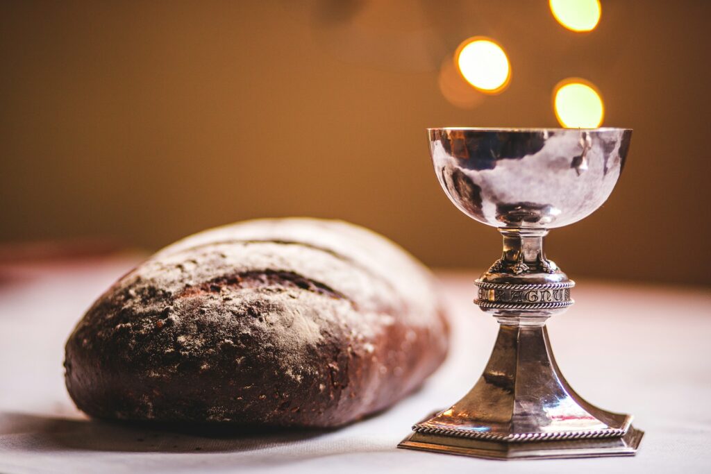Communion Debate Returns: Leo XIV revives The Joy of Love A chalice and loaf of bread for communion.