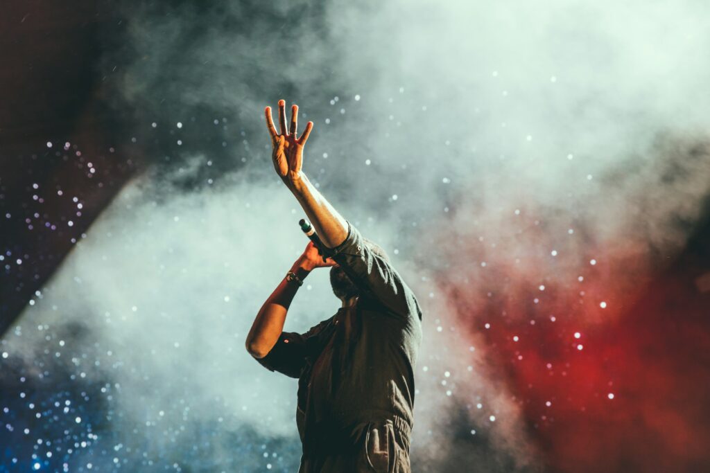 A man singing at a concert.