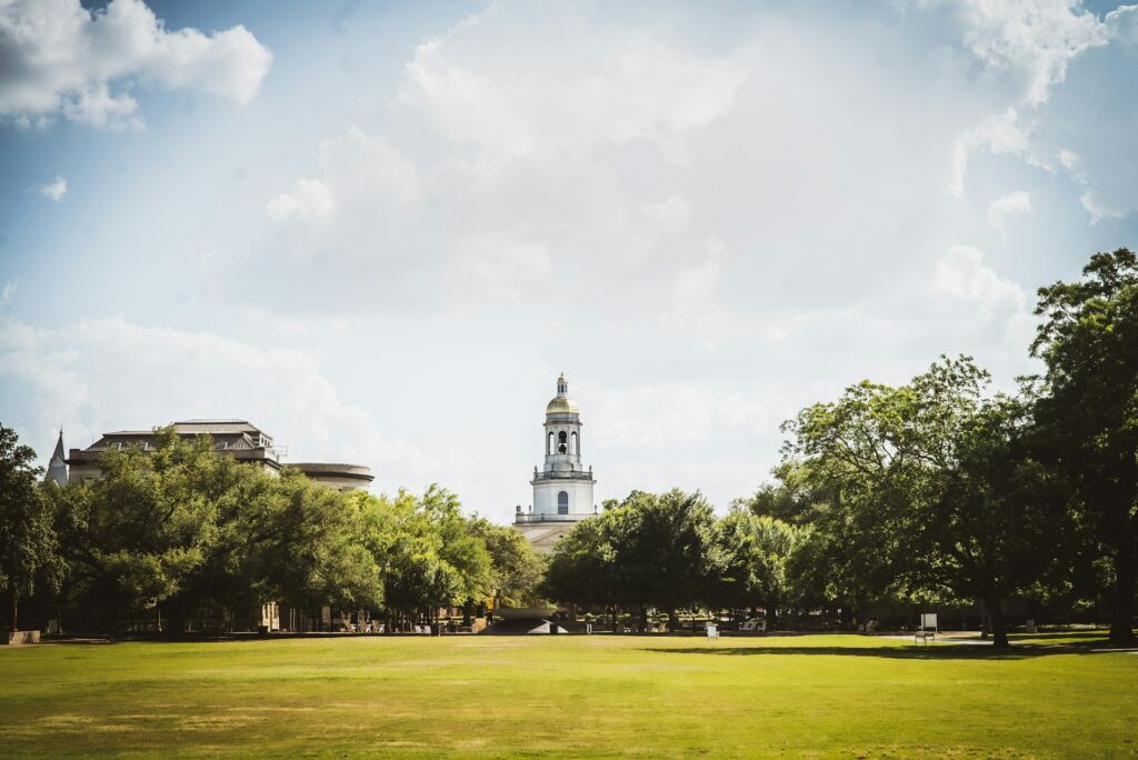 An image of Baylor's campus behind trees.
