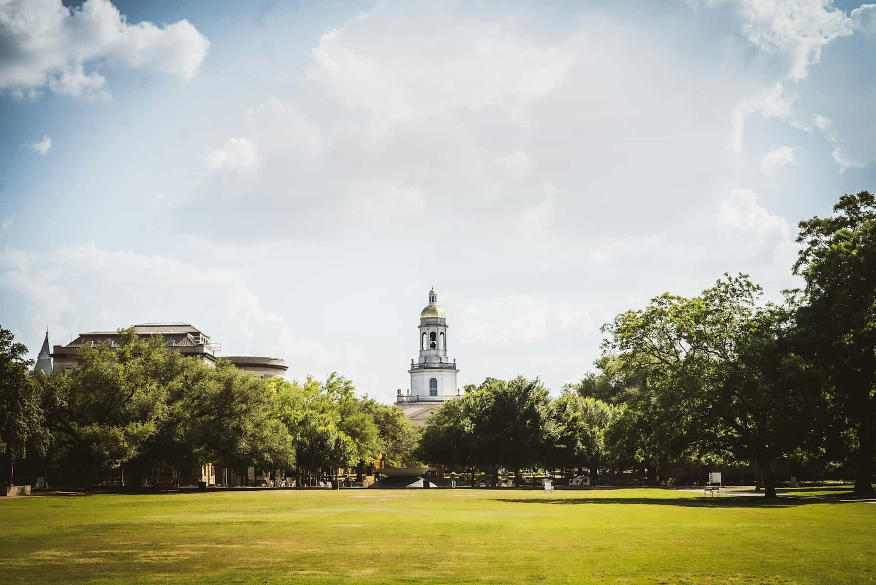 An image of Baylor's campus behind trees.