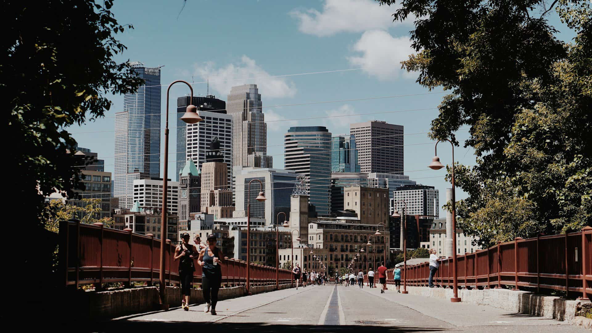 A skyline with joggers in the foreground.