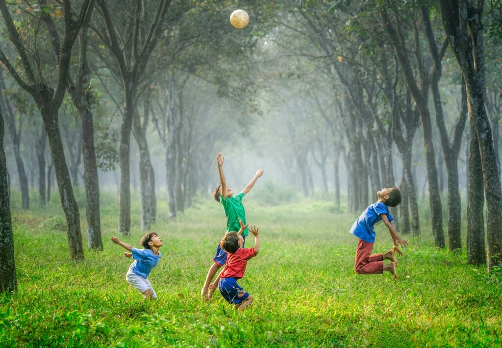 A group of boys playing with a soccer ball.