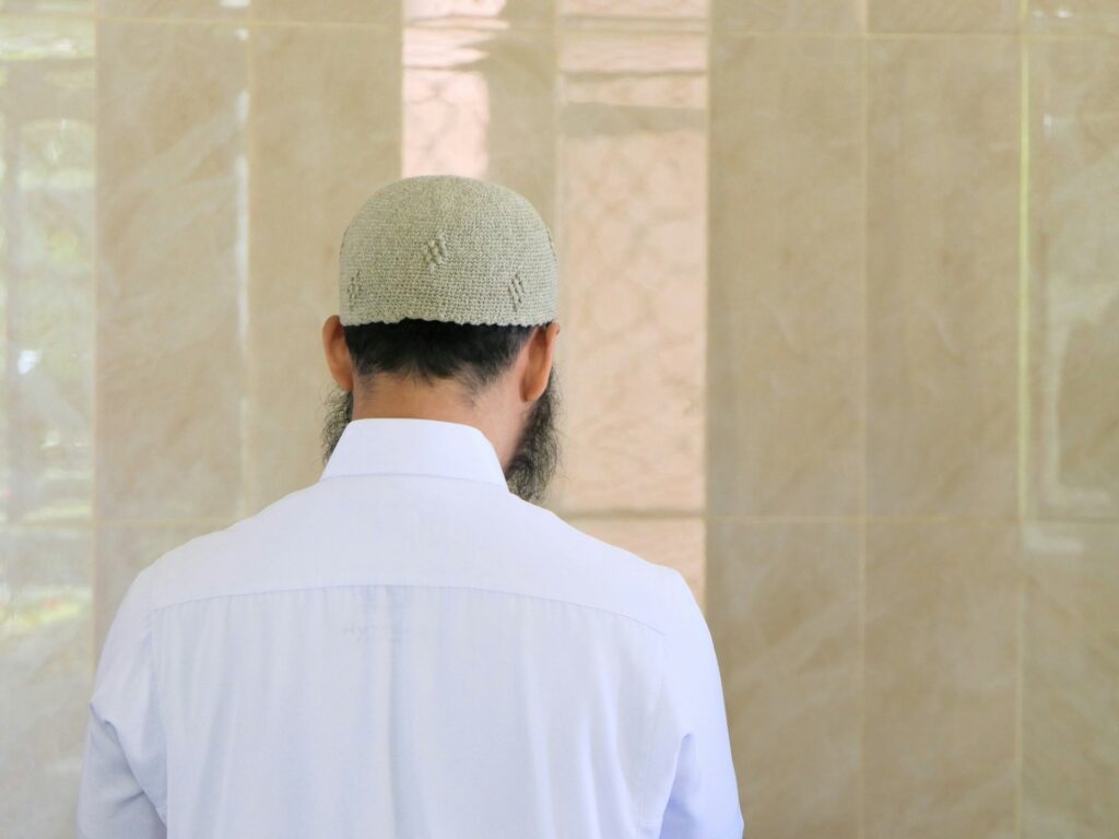 A Muslim man seen from behind.